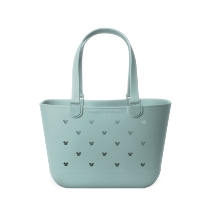Soft sage green tote bag with dark gray-green cutout details and handles